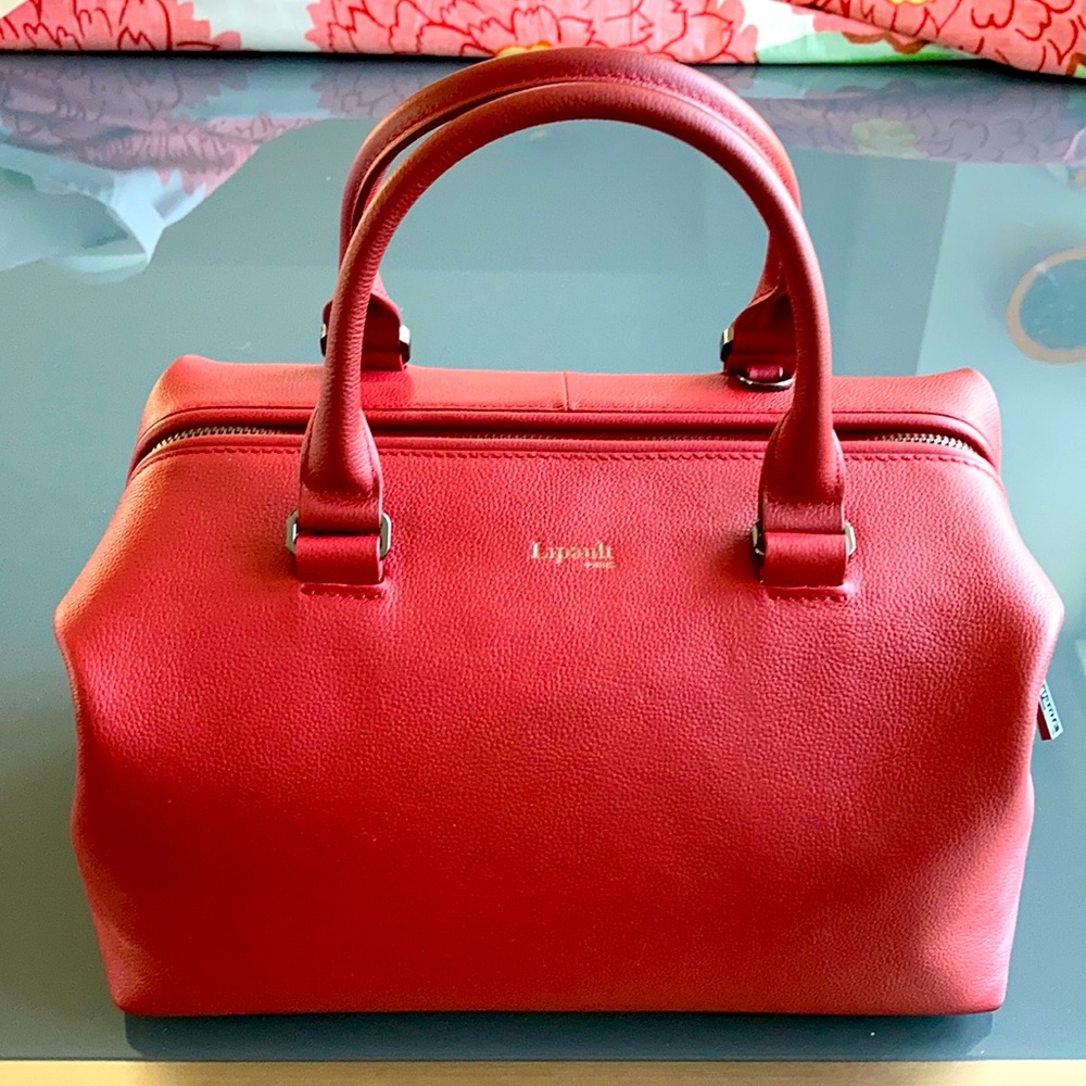 French Lipault cranberry red purse with optional shoulder strap.